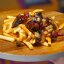 Картофель фри с колбасками и грибами