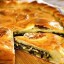 Пирог с яйцами, куриной печенью, жареной морковью, луком и картофелем