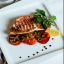 Морской окунь с томлёными овощами
