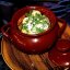 Драники с куриными колбасками в горшочке