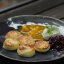 Сырники с лаймовой сметаной, соусом Манго-маракуйя и вишневым компоте