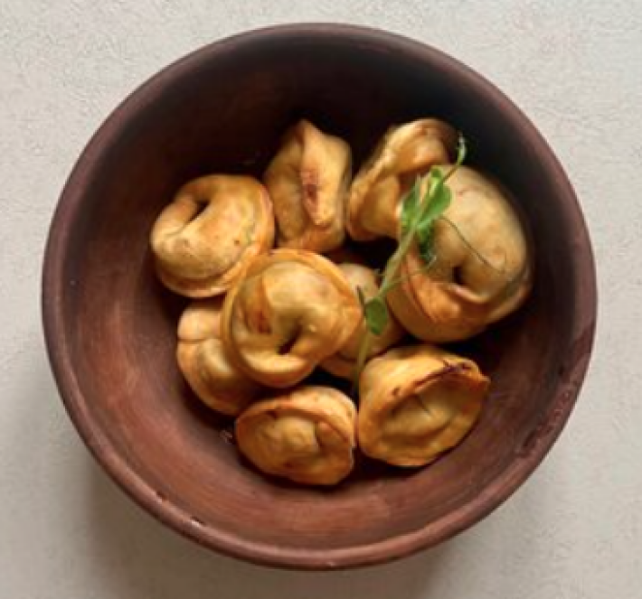 Пельмени жареные с капустой шампиньонами и луком