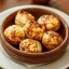 Шампиньоны, фаршированные сыром запечённые в кеци