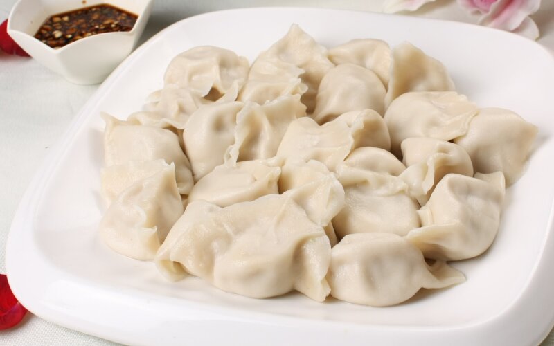 Пельмени со свининой и квашеной капустой