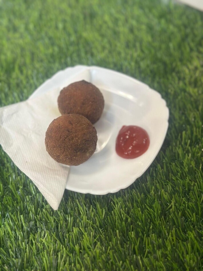 Two chicken cutlet with ketchup