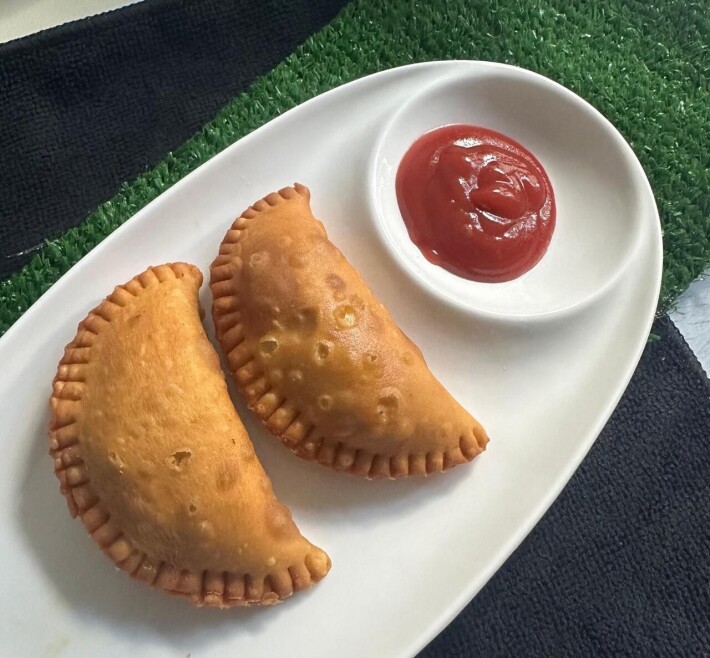Two chicken patties with ketchup