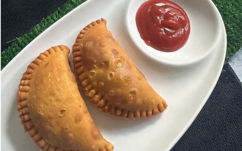 Two chicken patties with ketchup